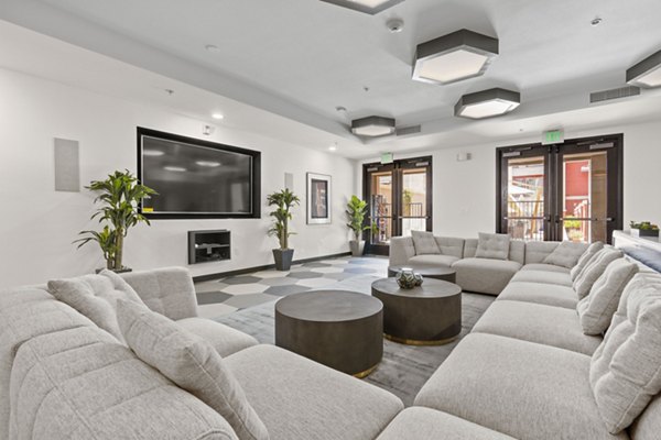 Clubhouse featuring modern design and cozy seating at San Pedro Bank Lofts Luxury Apartments