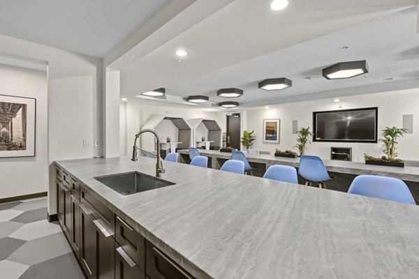 Clubhouse with modern design and vibrant seating area at San Pedro Bank Lofts luxury apartments