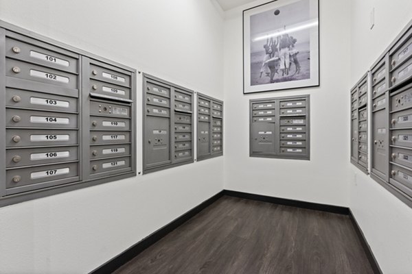 Mail room with secure parcel lockers at San Pedro Bank Lofts luxury apartments in Los Angeles