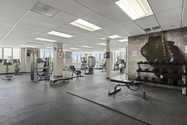 Modern fitness center with state-of-the-art equipment at San Pedro Bank Lofts apartments