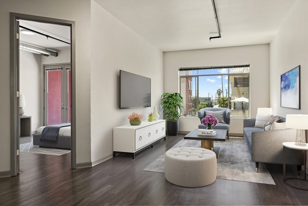 Stylish living room with exposed brick walls and modern decor in San Pedro Bank Lofts