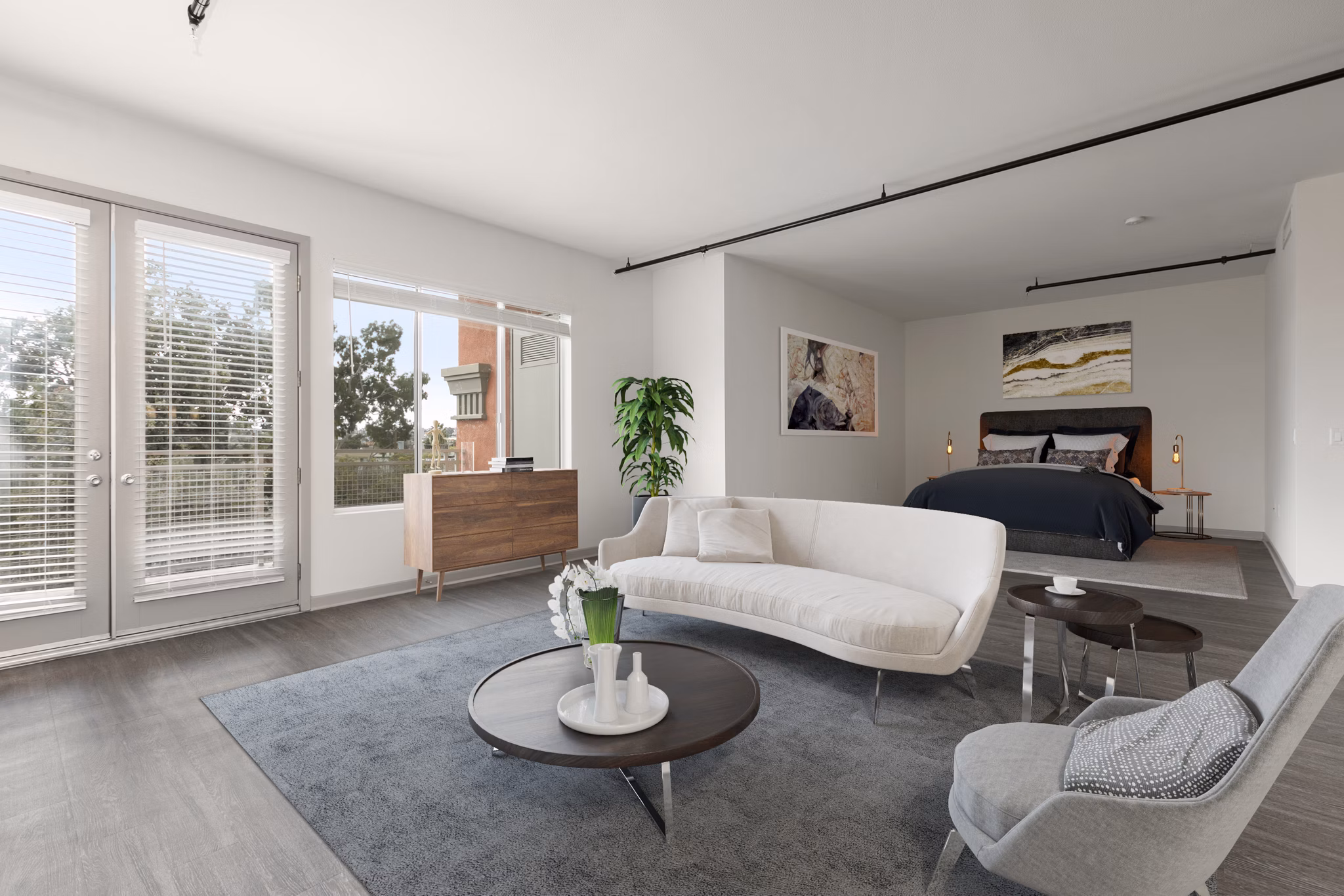 Modern living room with open floor plan at San Pedro Bank Lofts, featuring elegant furnishings and abundant natural light