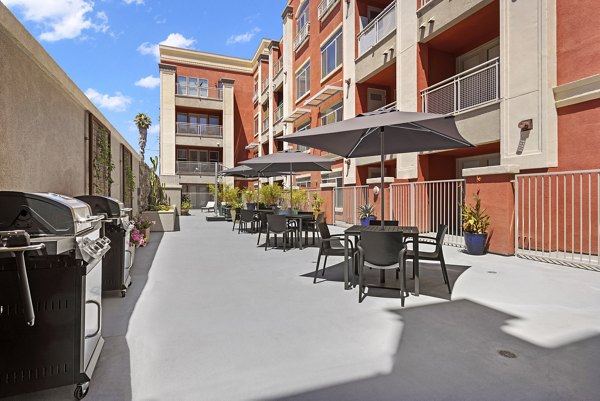 Outdoor grill area with modern seating at San Pedro Bank Lofts