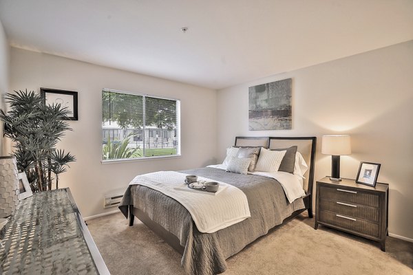 Cozy bedroom with stylish decor at Alvista at the Bridge Apartments