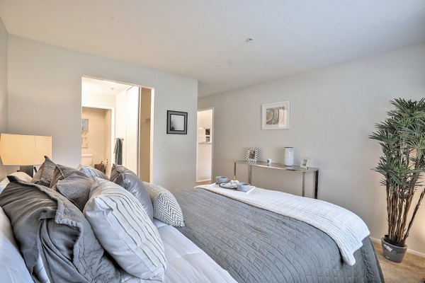 Cozy bedroom with modern furnishings in Alvista at the Bridge Apartments
