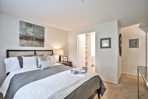 Cozy bedroom with modern decor at Alvista at the Bridge Apartments