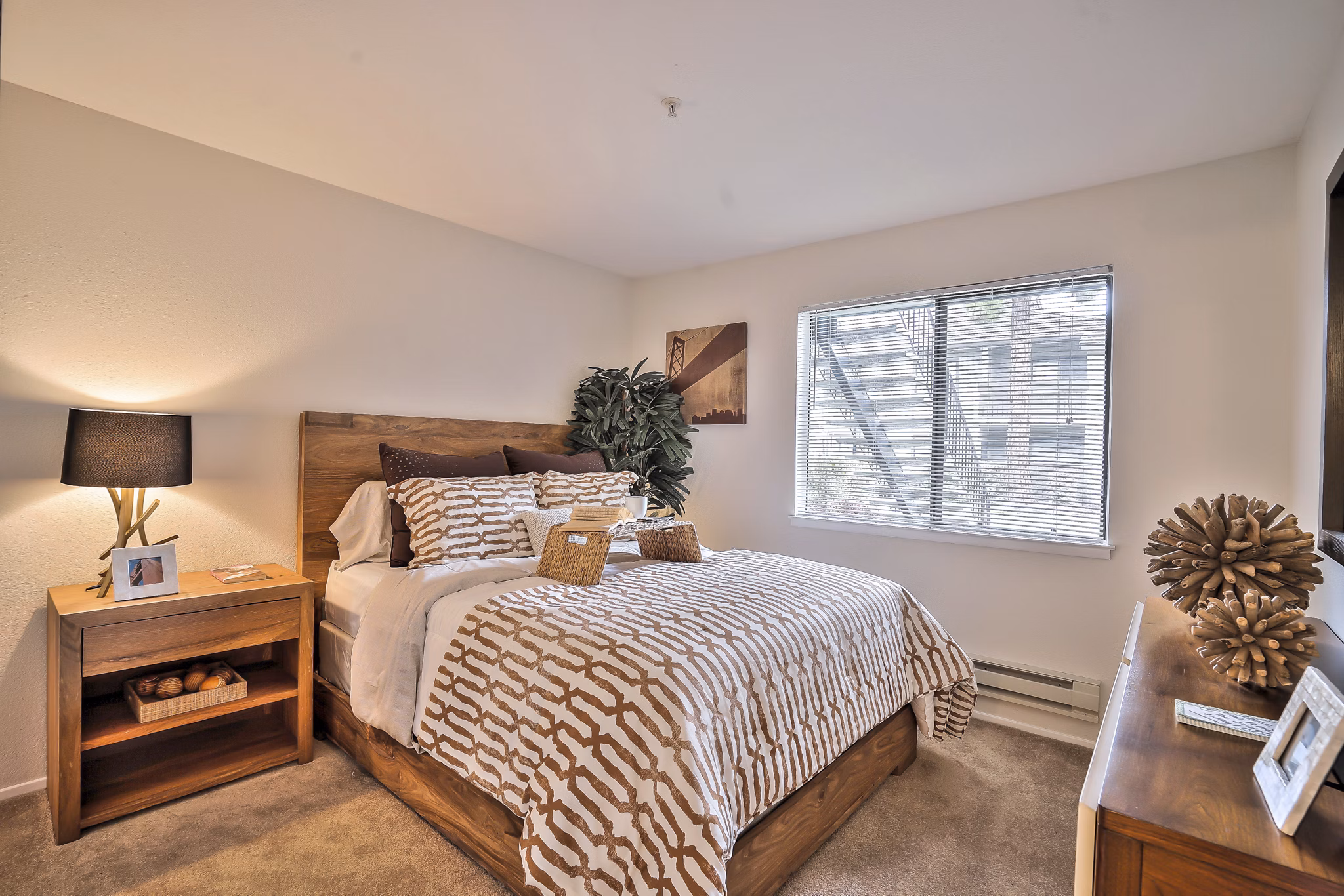 Cozy bedroom with modern dÃ©cor at Alvista at the Bridge Apartments featuring luxurious bedding and ample natural light