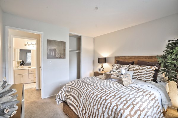 Cozy bedroom with modern decor in Alvista at the Bridge Apartments