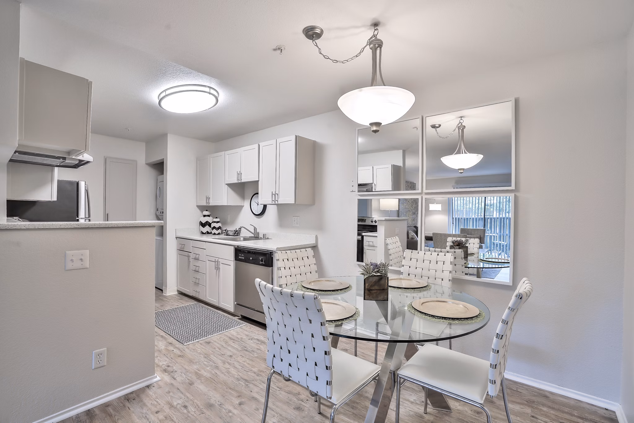 Dining area with modern furnishings at Alvista at the Bridge Apartments, offering luxury living spaces in Hayward, CA.