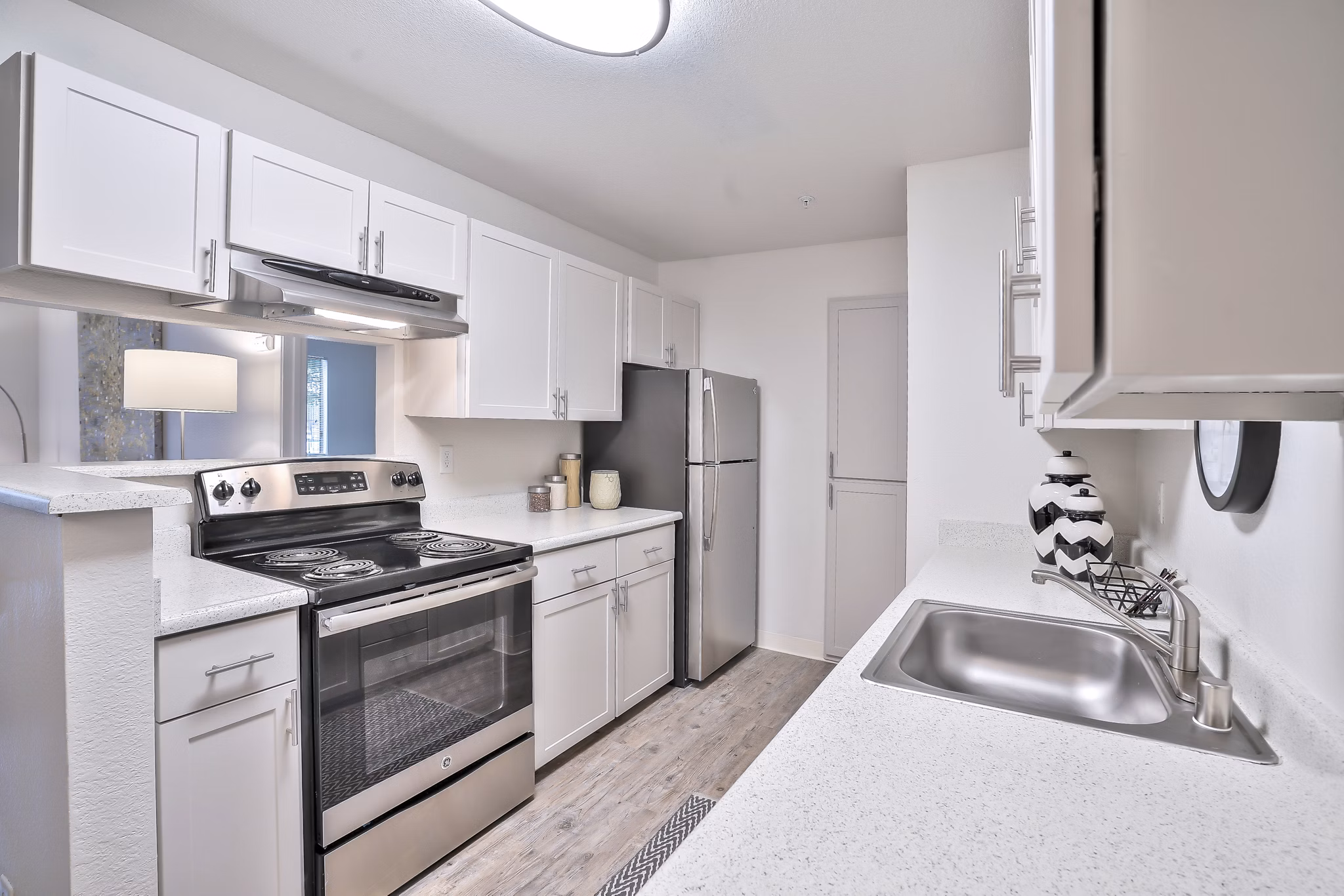 Modern kitchen with stainless steel appliances at Alvista at the Bridge Apartments, designed for luxury living in a vibrant community
