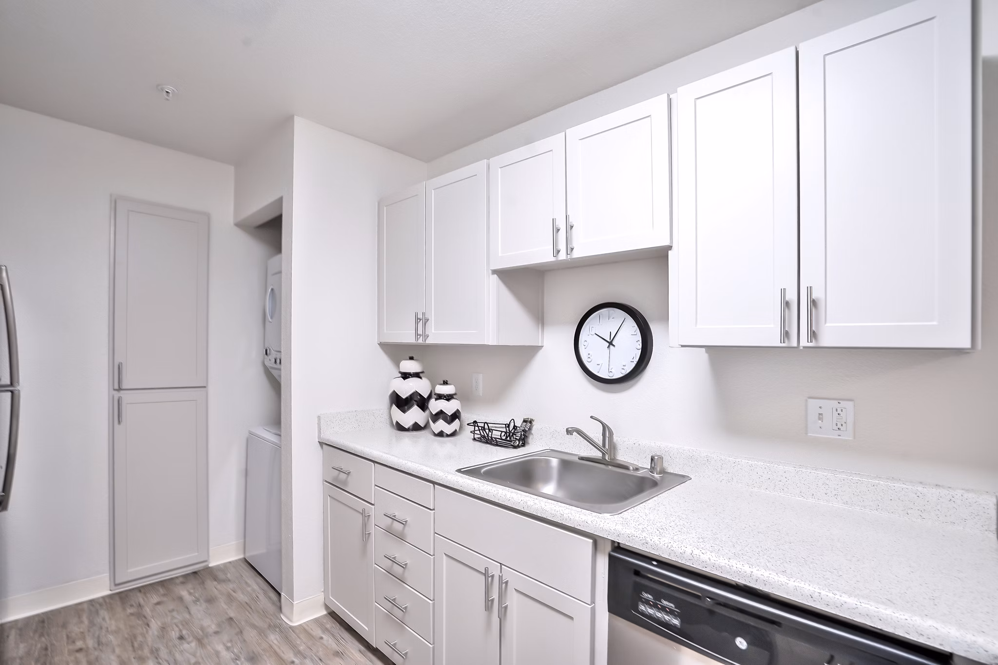 Modern kitchen with sleek cabinetry and stainless steel appliances in Alvista at the Bridge Apartments, luxury living near urban amenities