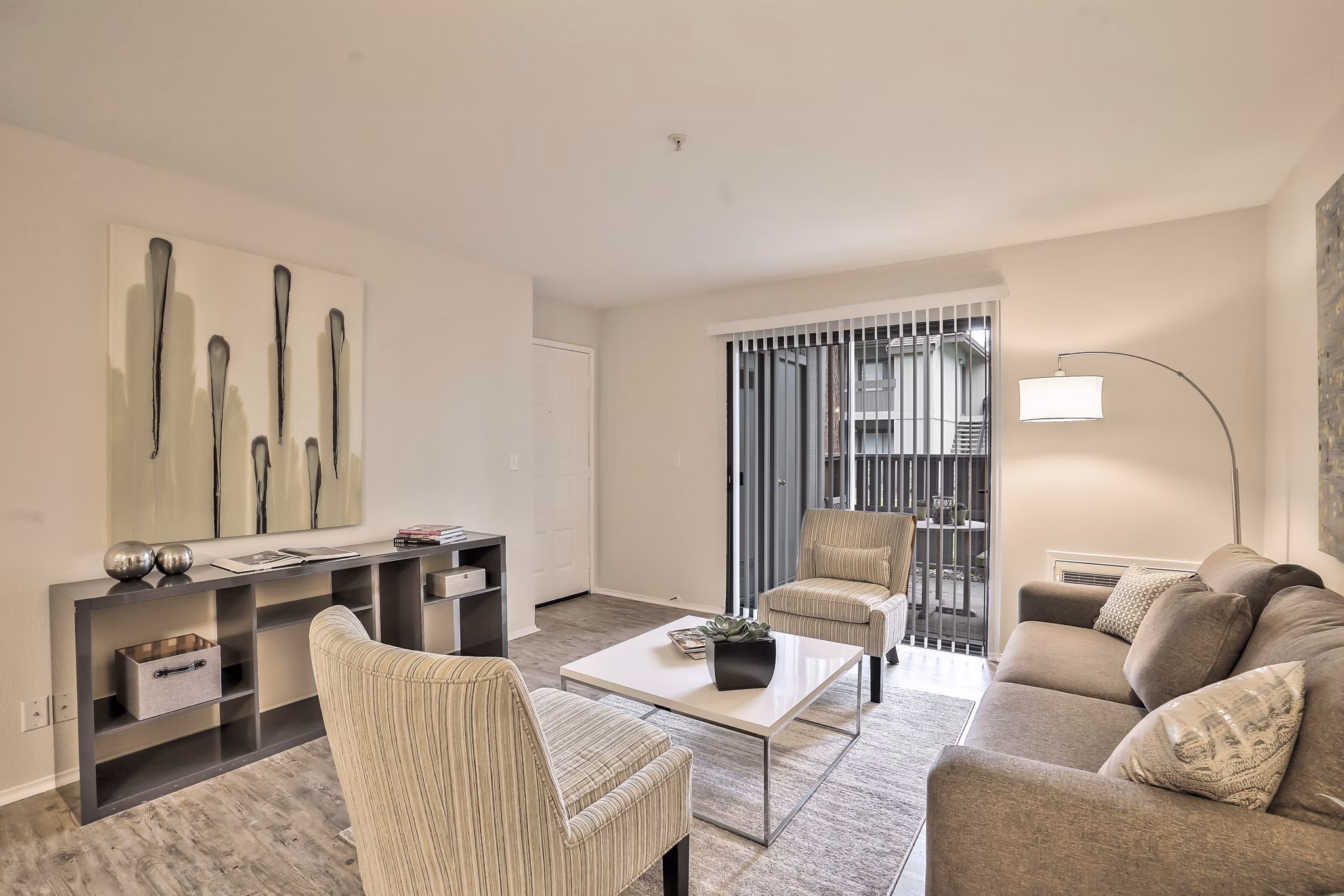 Living room with modern furnishings at Alvista at the Bridge Apartments