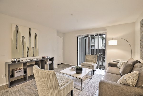 Living room with modern furnishings at Alvista at the Bridge Apartments