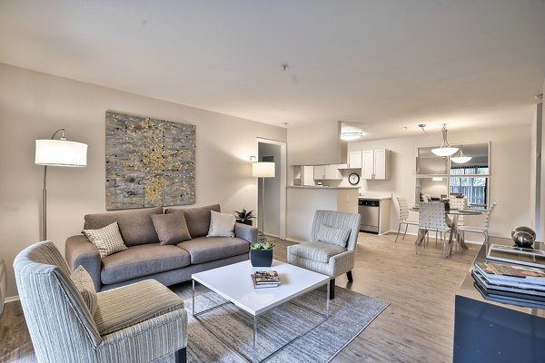 Spacious living room with modern decor at Alvista at the Bridge Apartments, offering comfort and style for luxury living
