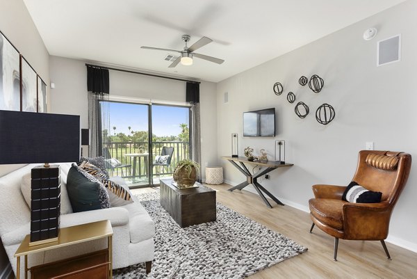 Summit at San Marcos Apartments: Chic living room with modern decor and natural light