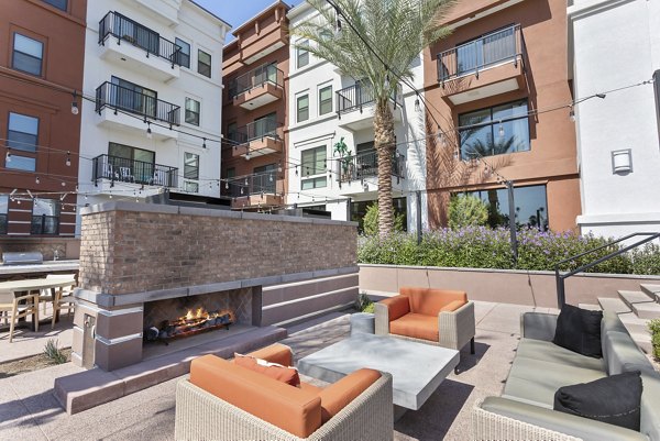 Cozy fire pit surrounded by seating at Summit at San Marcos Apartments, perfect for outdoor relaxation