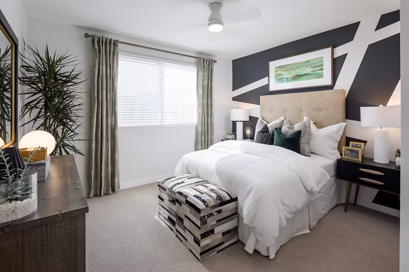 Contemporary bedroom with elegant decor at Boardwalk at Millenia Apartments