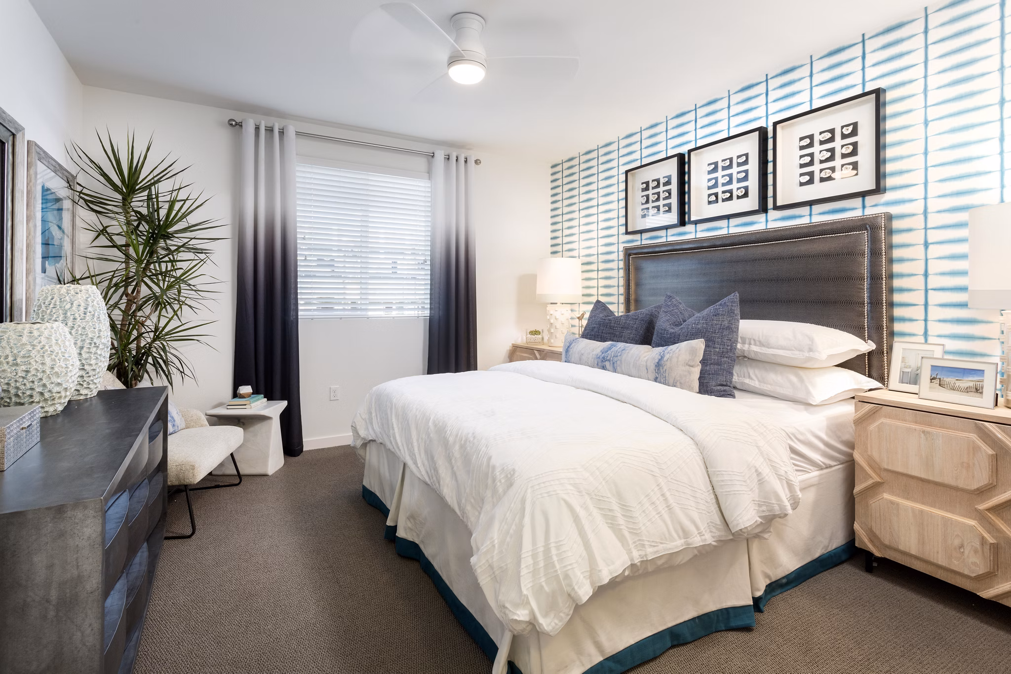 Cozy bedroom with elegant furnishings at Boardwalk at Millenia Apartments, luxurious Greystar property