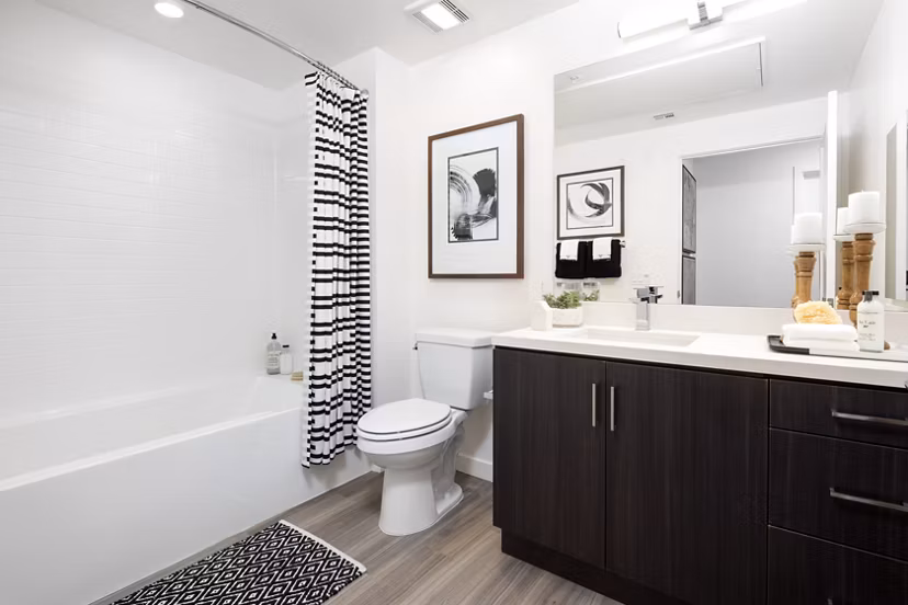 Bathroom with sleek modern fixtures in Boardwalk at Millenia Apartments