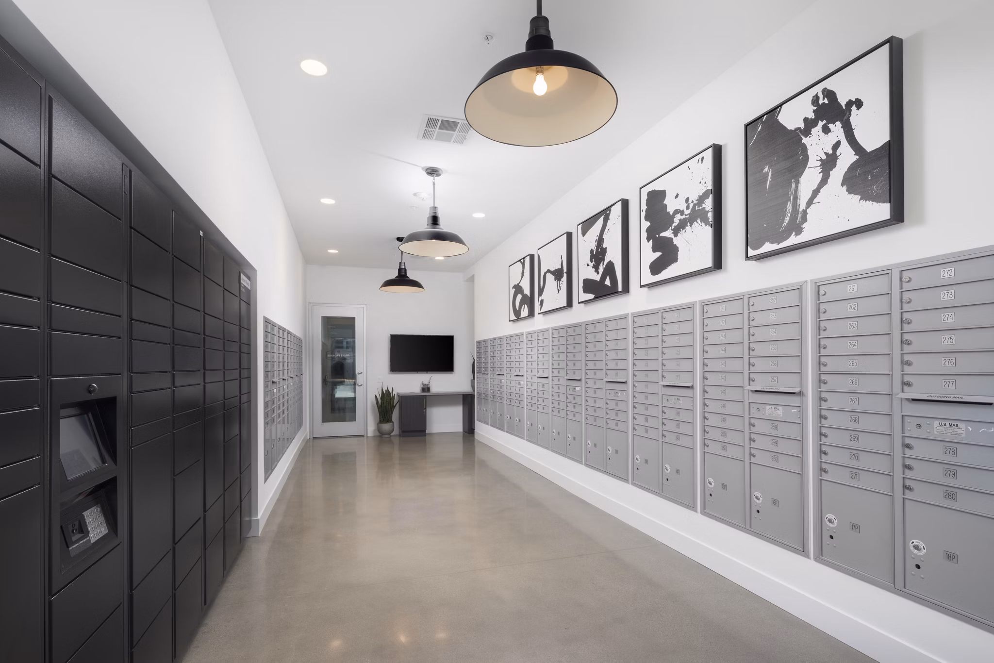 Mail room with secure parcel lockers and modern design at Boardwalk at Millenia Apartments