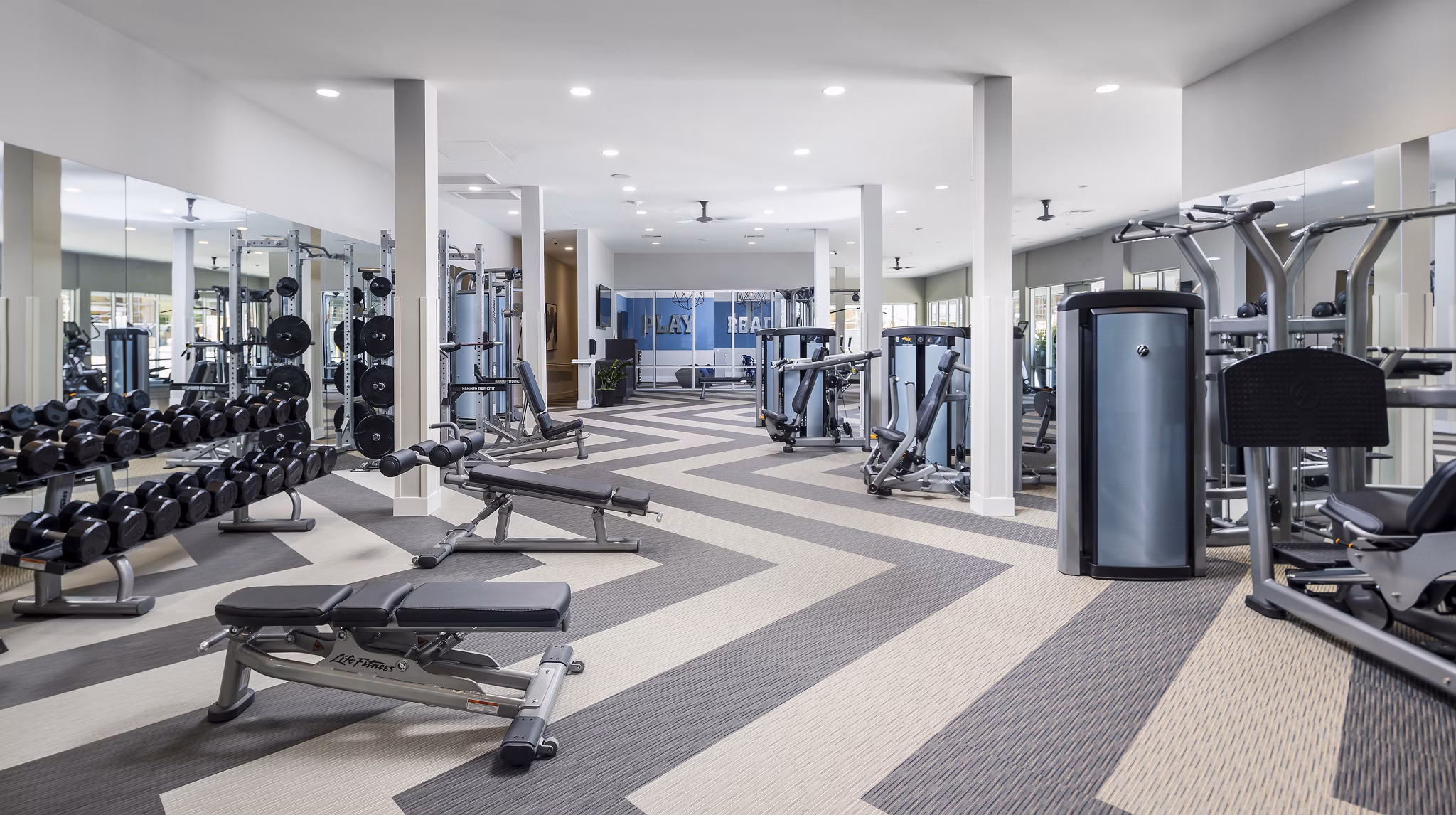 State-of-the-art fitness center with modern equipment at Boardwalk at Millenia Apartments