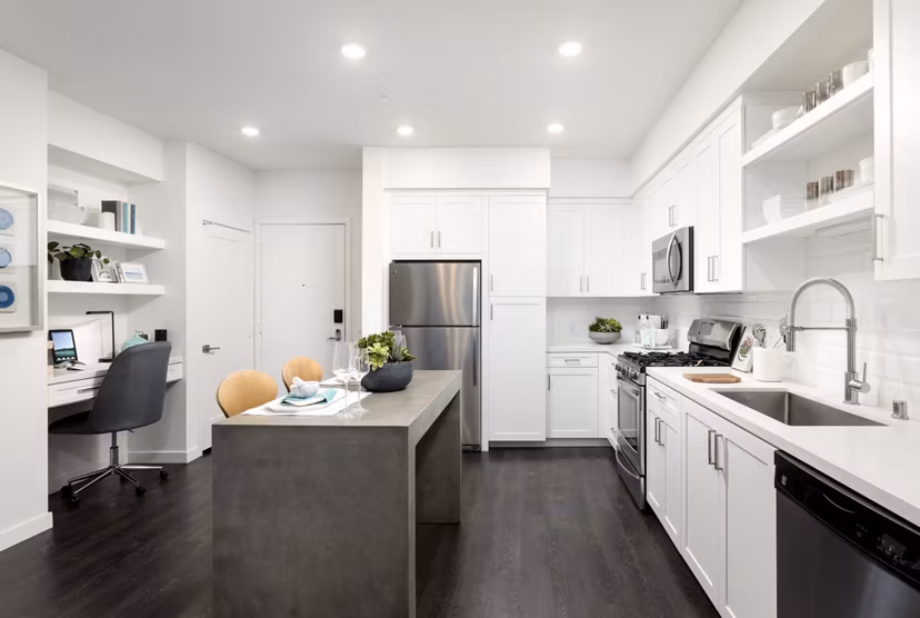 Modern kitchen with stainless steel appliances at Boardwalk at Millenia Apartments