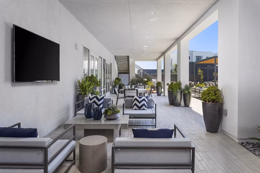 Spacious patio with modern seating at Boardwalk at Millenia Apartments, ideal for relaxation and outdoor dining