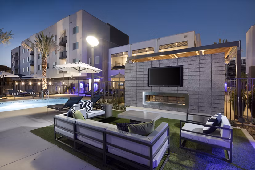 Cozy outdoor fire pit with seating at Boardwalk at Millenia Apartments, enhancing relaxation spaces