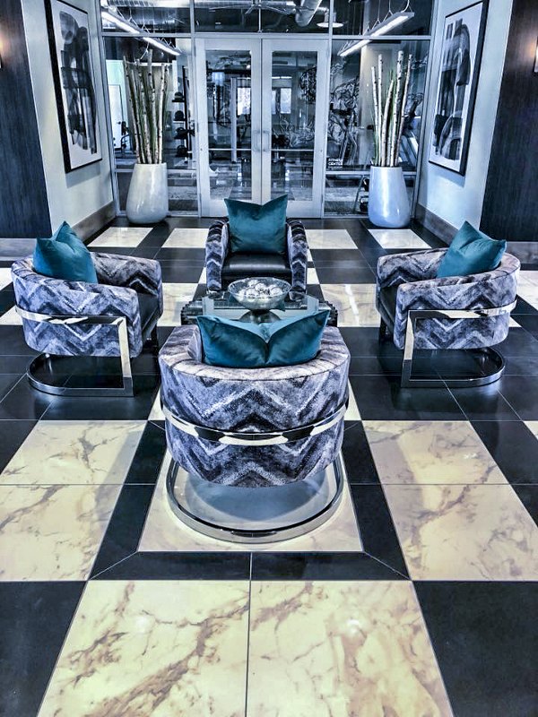 Clubhouse lobby at Peak 16 Apartments featuring modern design and luxurious seating areas