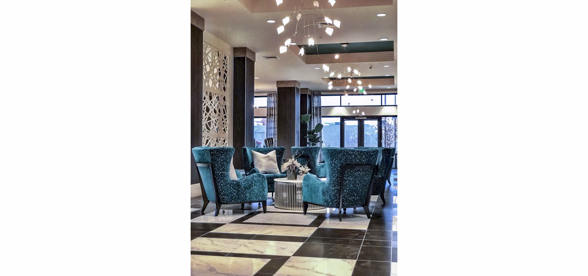 Clubhouse lobby with contemporary design and seating area at Peak 16 Apartments in vibrant city setting