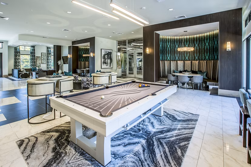 Game room with pool table and modern decor at Peak 16 Apartments