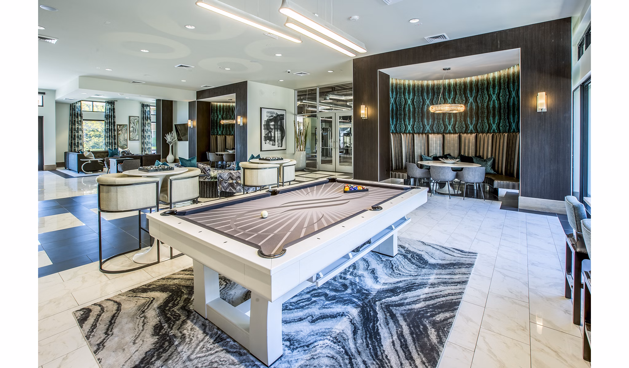 Game room with pool table and modern decor at Peak 16 Apartments