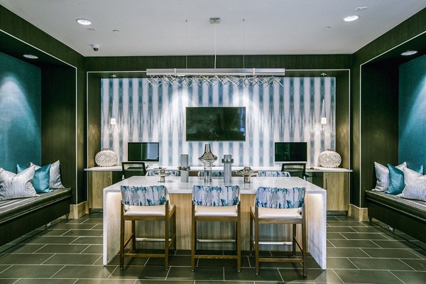 Modern clubhouse lounge with elegant decor in Peak 16 Apartments, offering a welcoming ambiance for residents