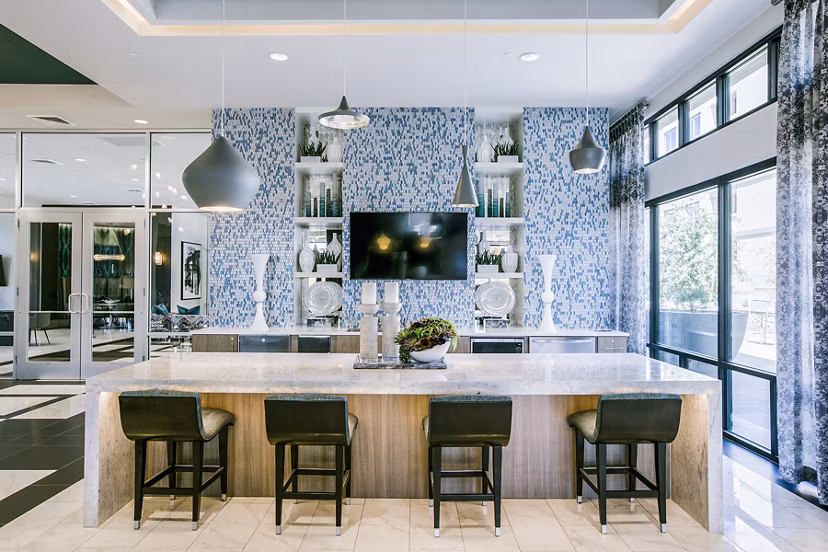 Clubhouse lobby with modern design and seating areas at Peak 16 Apartments