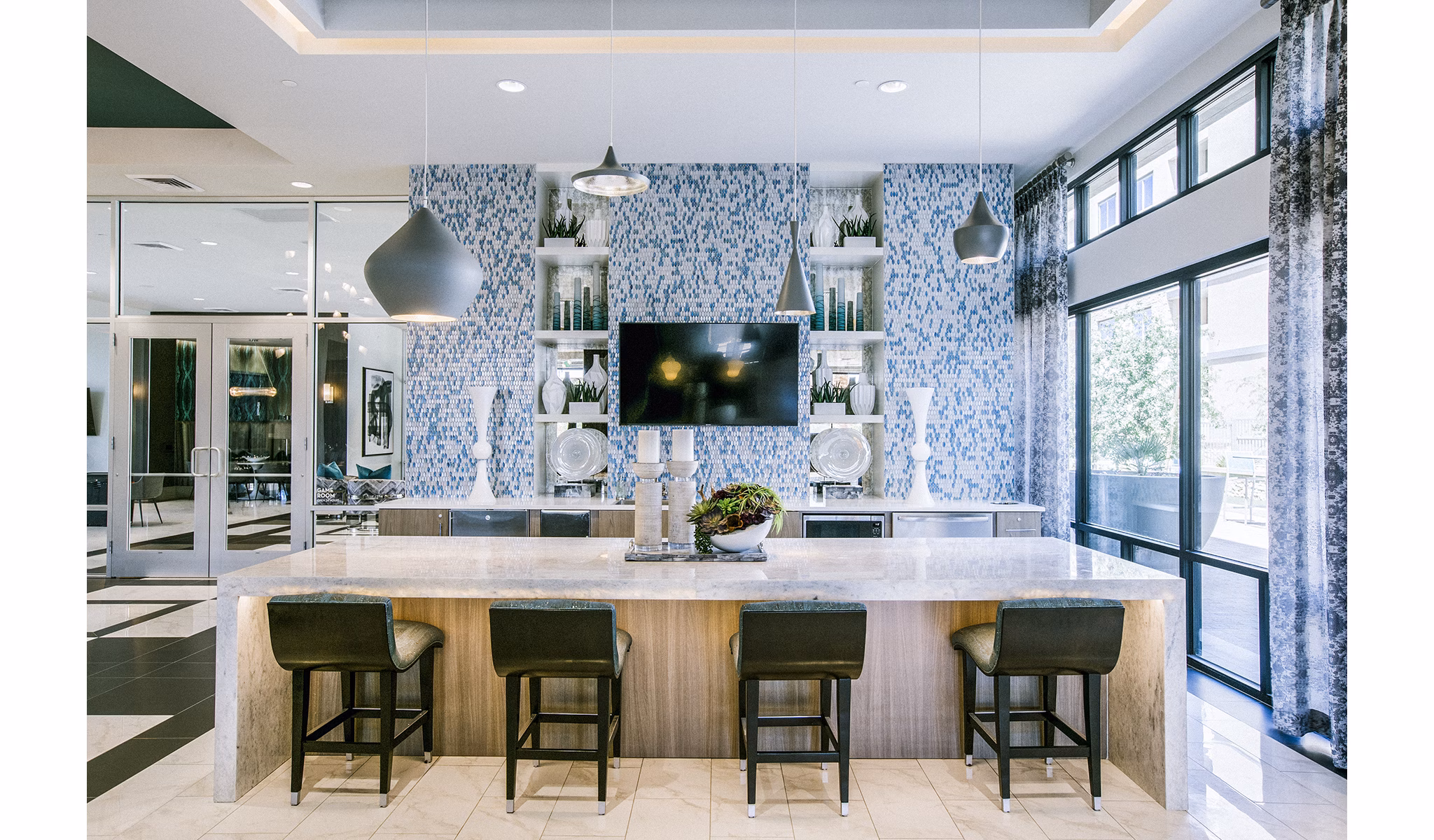 Clubhouse lobby with modern design and seating areas at Peak 16 Apartments