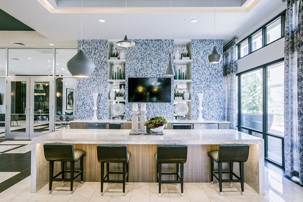 Clubhouse lobby with modern design and seating areas at Peak 16 Apartments