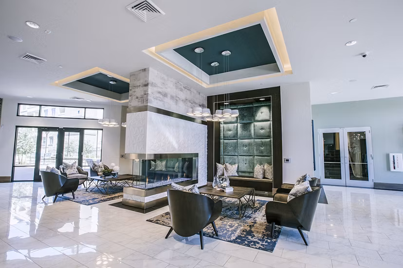 Modern clubhouse lobby with sleek furnishings at Peak 16 Apartments in vibrant setting