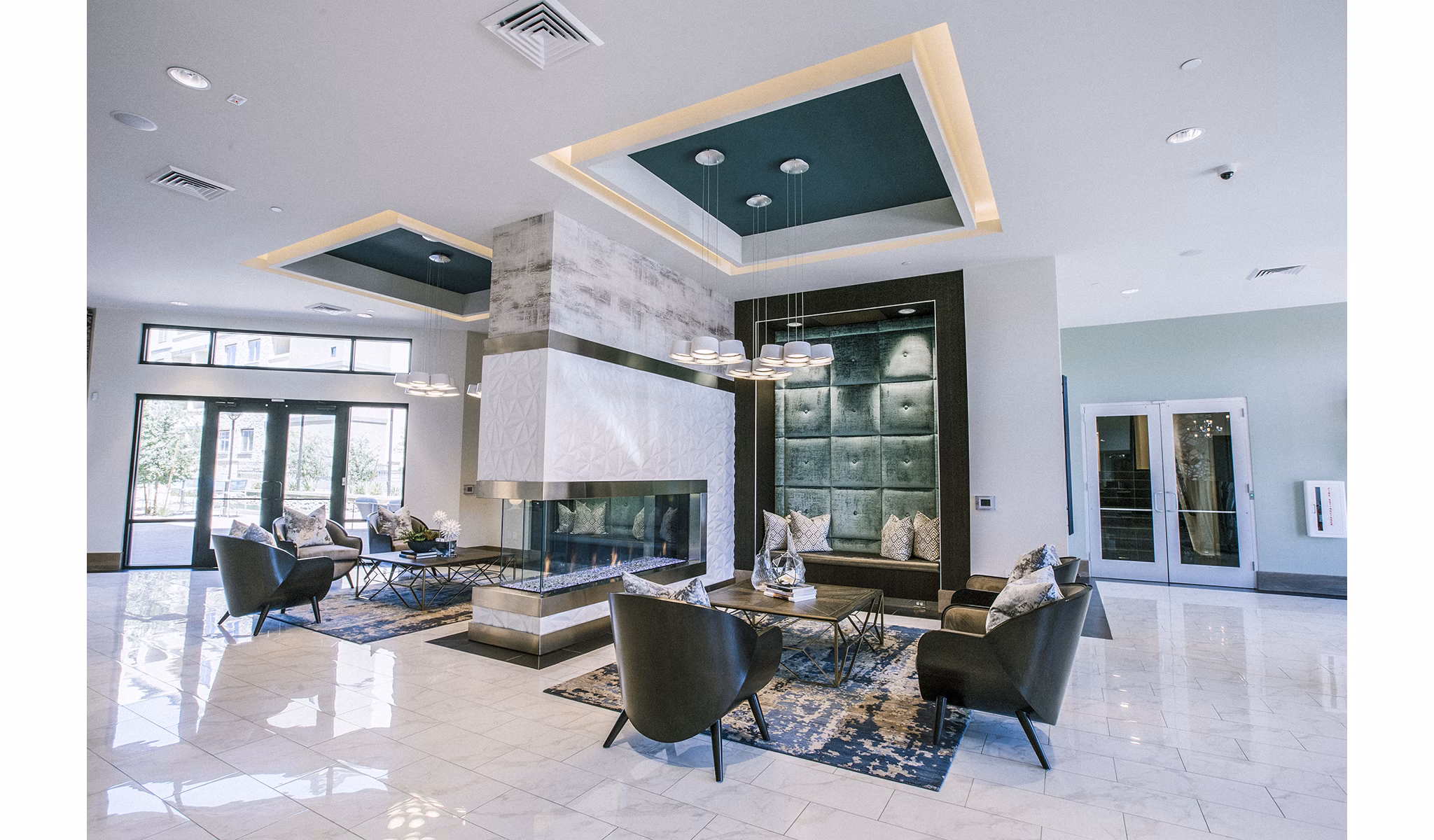 Modern clubhouse lobby with sleek furnishings at Peak 16 Apartments in vibrant setting