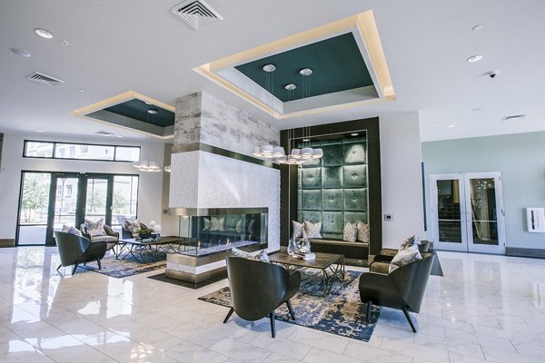 Modern clubhouse lobby with sleek furnishings at Peak 16 Apartments in vibrant setting