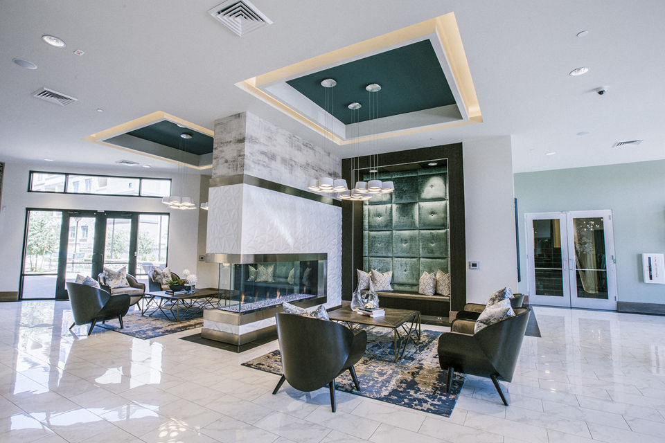 Modern clubhouse lobby with sleek furnishings at Peak 16 Apartments in vibrant setting
