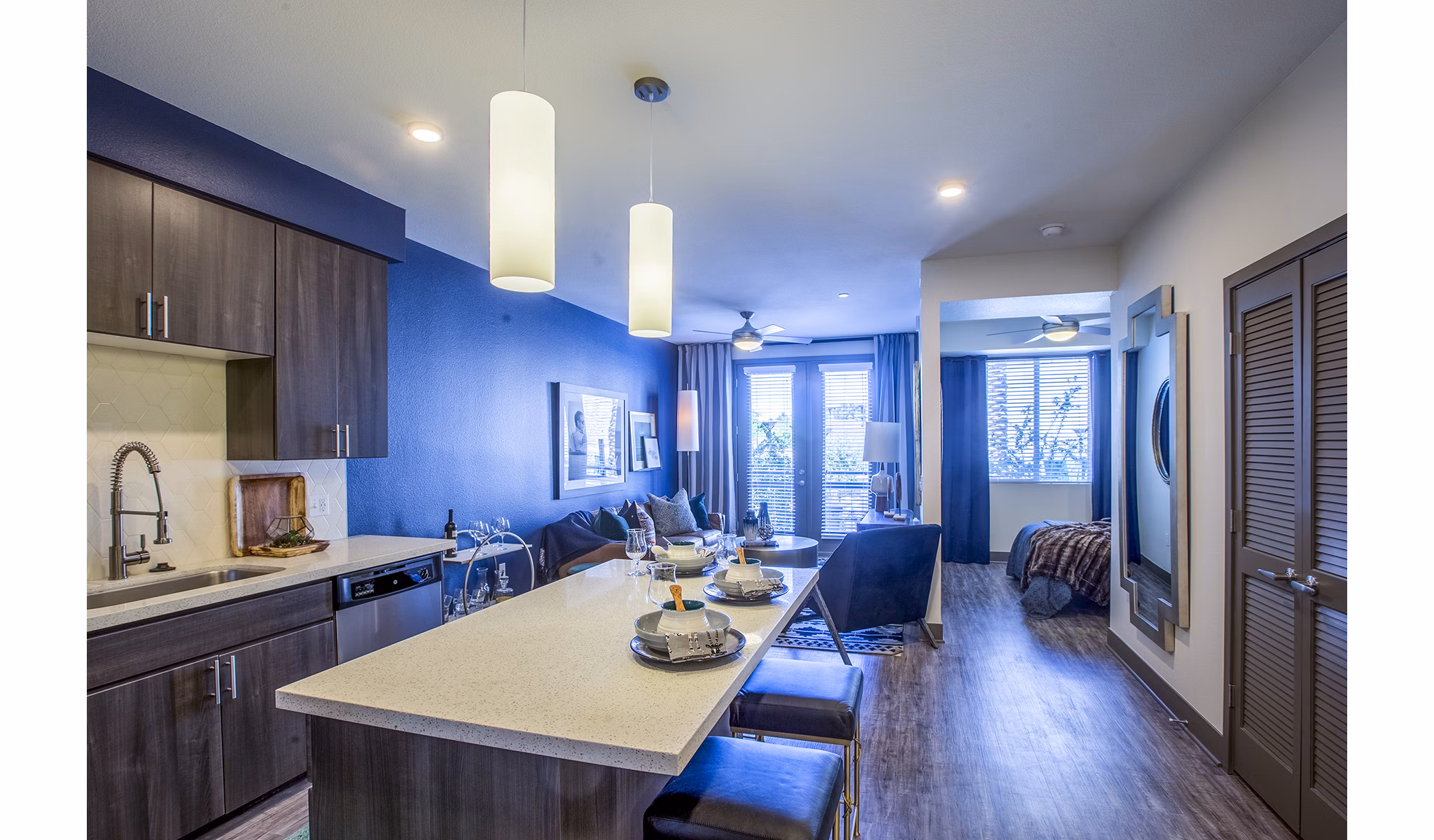 Dining room with elegant lighting and modern decor at Peak 16 Apartments
