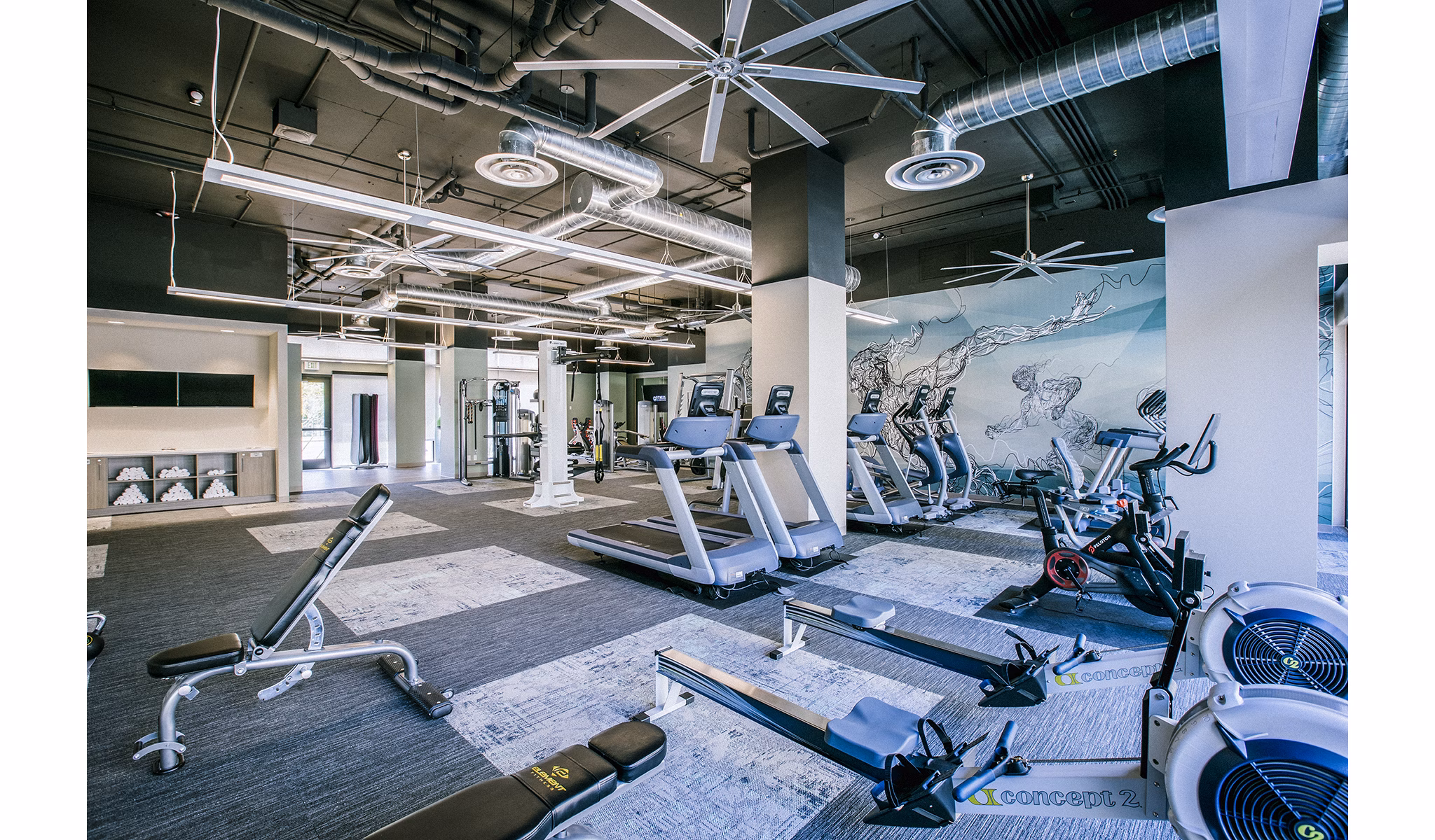 State-of-the-art fitness center with modern equipment at Peak 16 Apartments