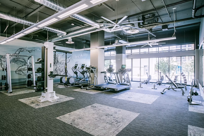 State-of-the-art fitness center with modern equipment at Peak 16 Apartments