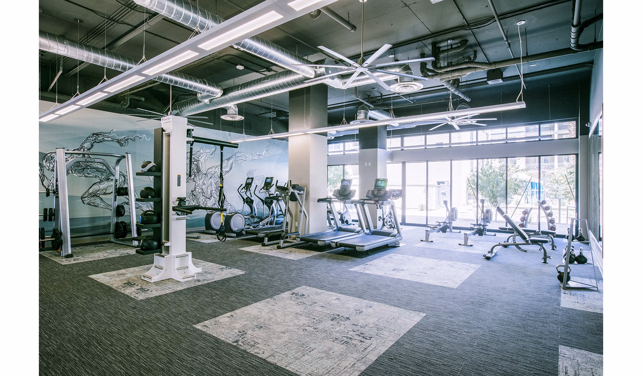 State-of-the-art fitness center with modern equipment at Peak 16 Apartments