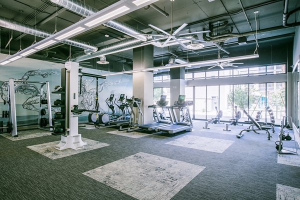 State-of-the-art fitness center with modern equipment at Peak 16 Apartments