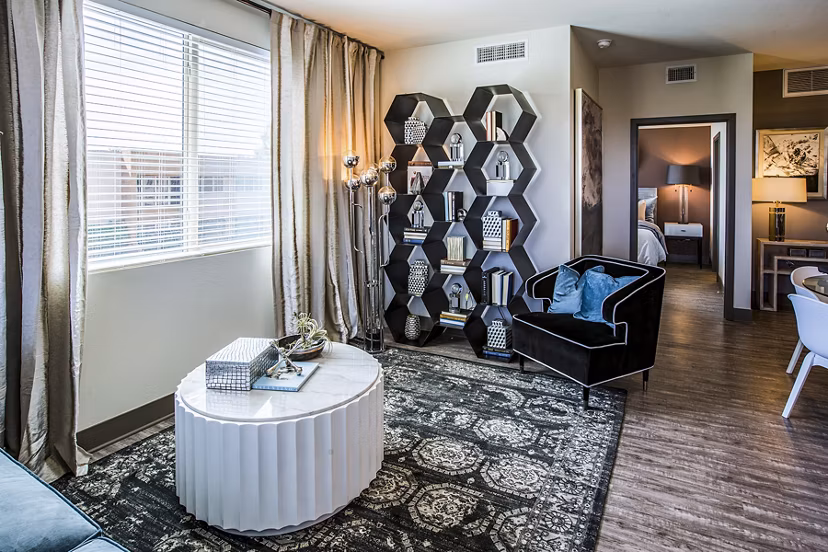 Living room with modern furnishings and natural light at Peak 16 Apartments, Greystar luxury residences in downtown Phoenix