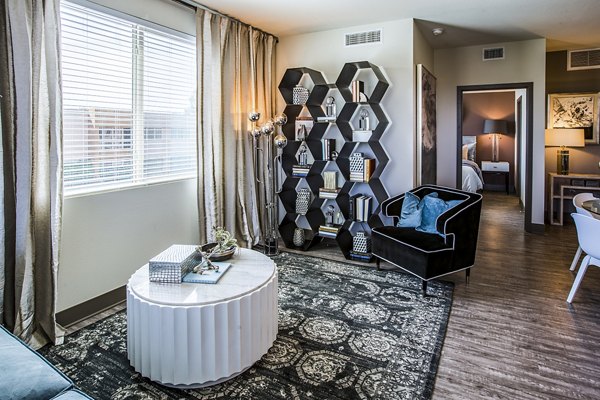 Living room with modern furnishings and natural light at Peak 16 Apartments, Greystar luxury residences in downtown Phoenix