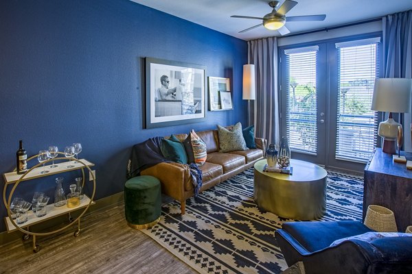 Spacious living room with modern furnishings at Peak 16 Apartments