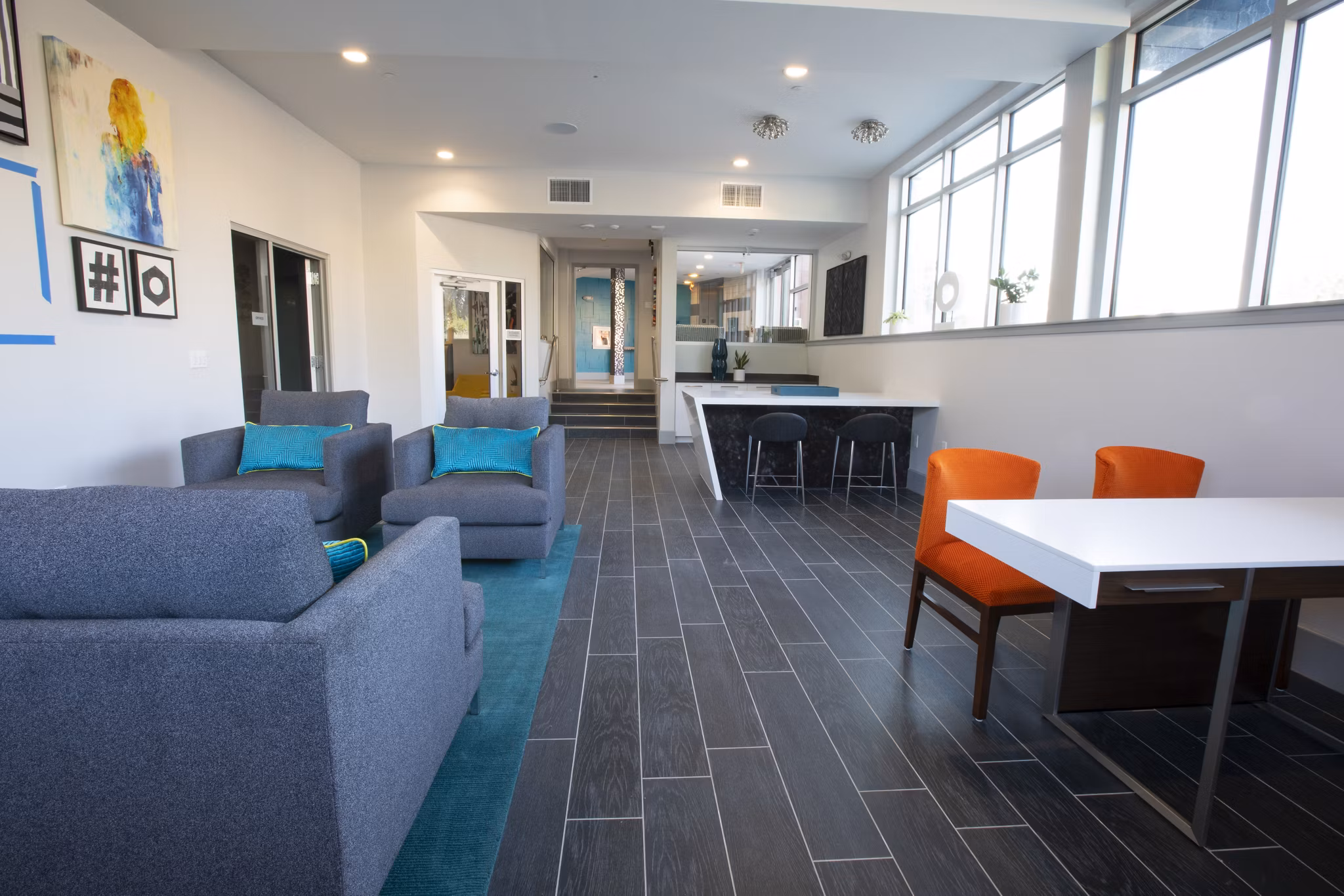 Clubhouse featuring modern design and cozy seating at Vaya Apartments in Greystar luxury community