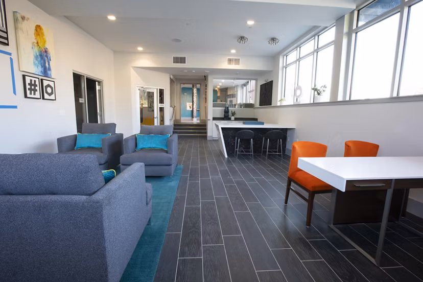 Clubhouse featuring modern design and cozy seating at Vaya Apartments in Greystar luxury community
